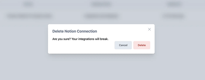 Confirmation dialog titled āDelete Notion Connectionā with warning text and two buttons: āCancelā (grey) and āDeleteā (red).